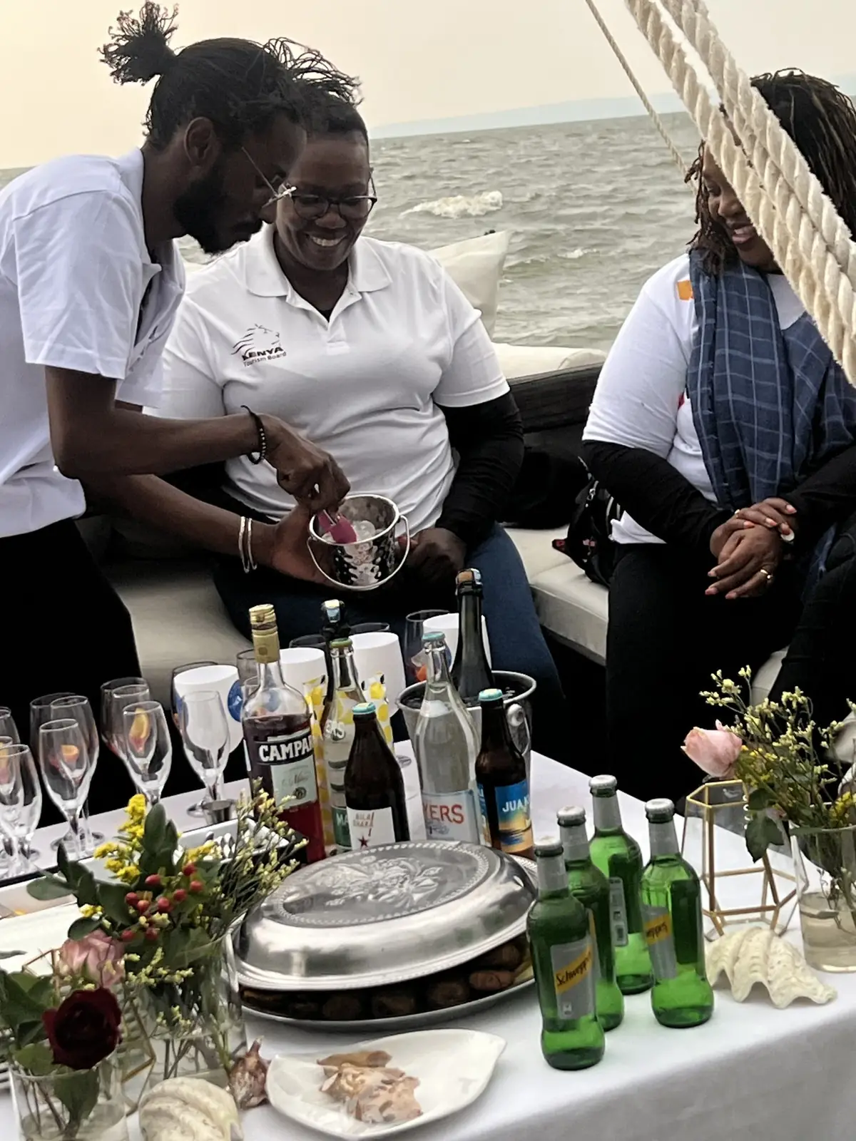 Guests sharing aperitifs on board a lakeside excursion