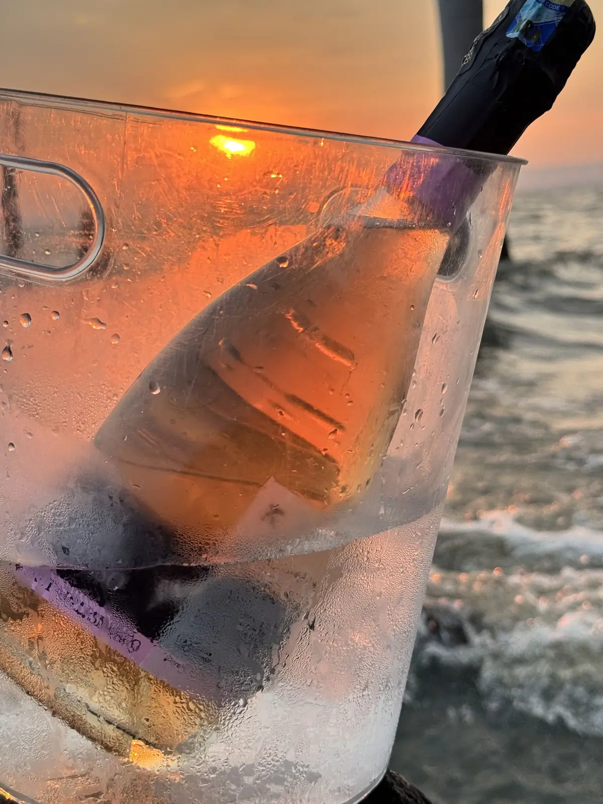 A bottle chilling at sunset