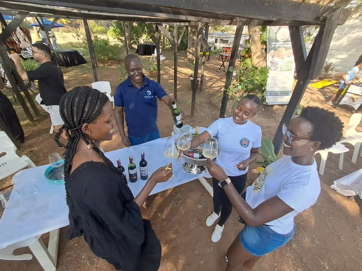 Guests tasting wine at the market wine table