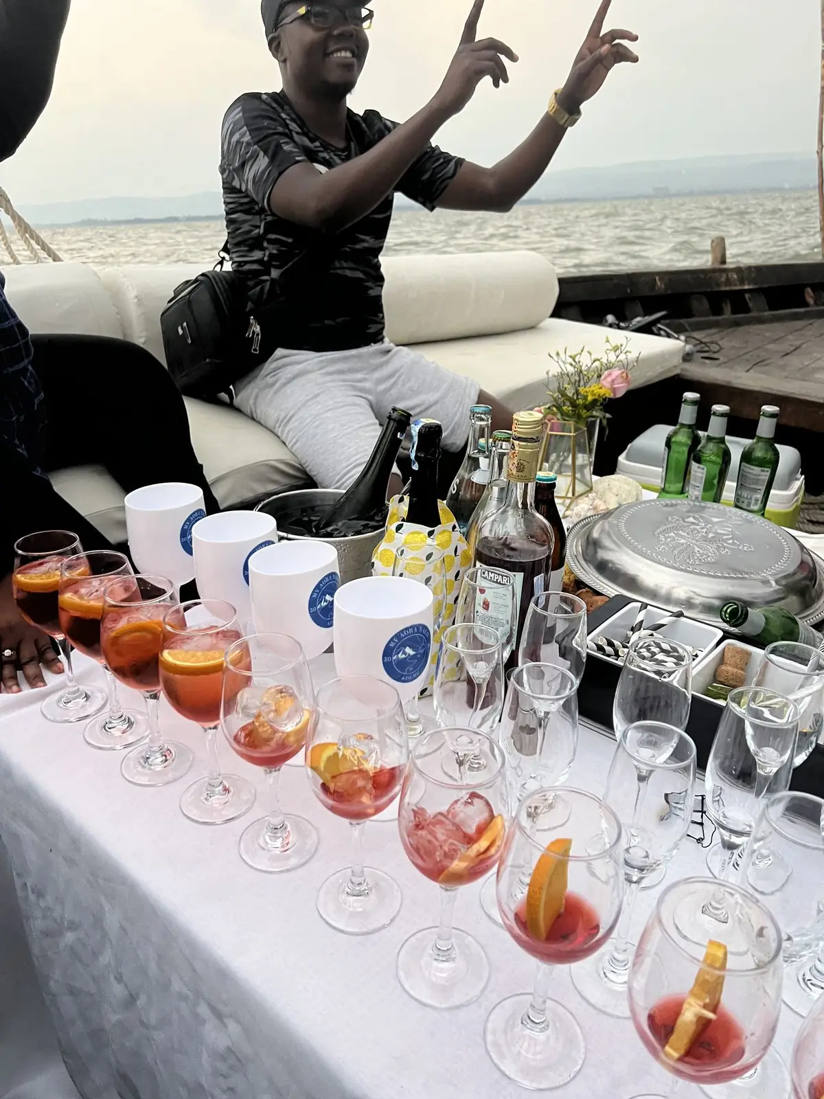 Aperitifs poured on board during a lakeside excursion