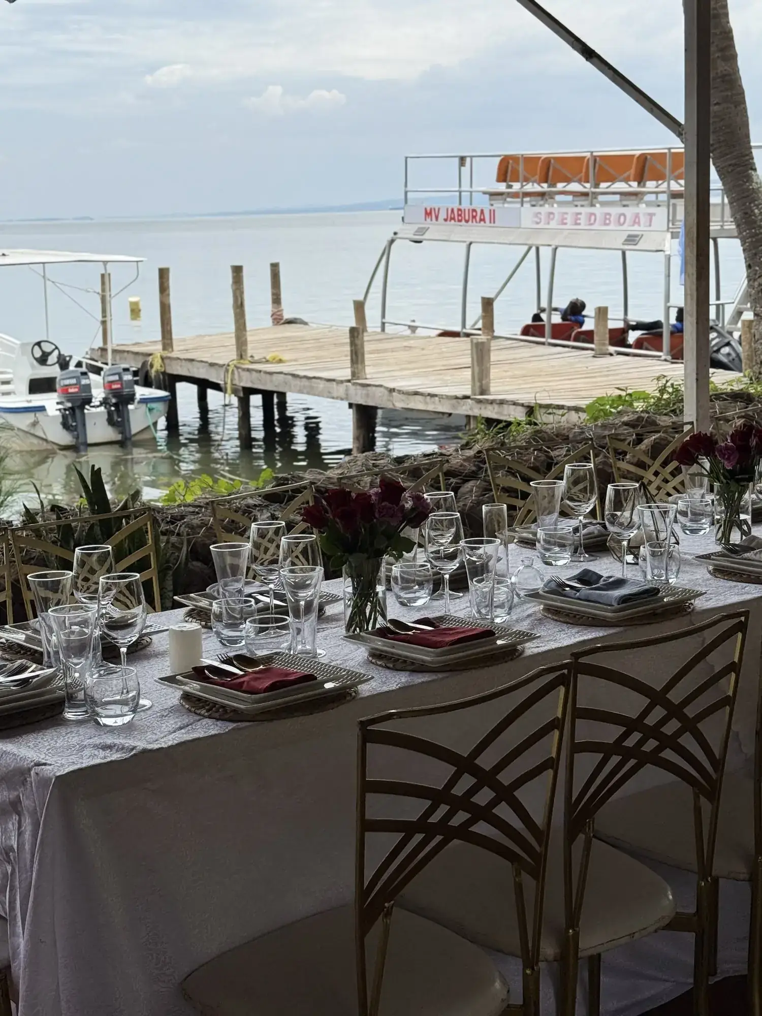 A table set beside the jetty with MV Jabura II alongside